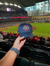 Load image into Gallery viewer, OG 713 astronaut navy club cap held at a Houston baseball game